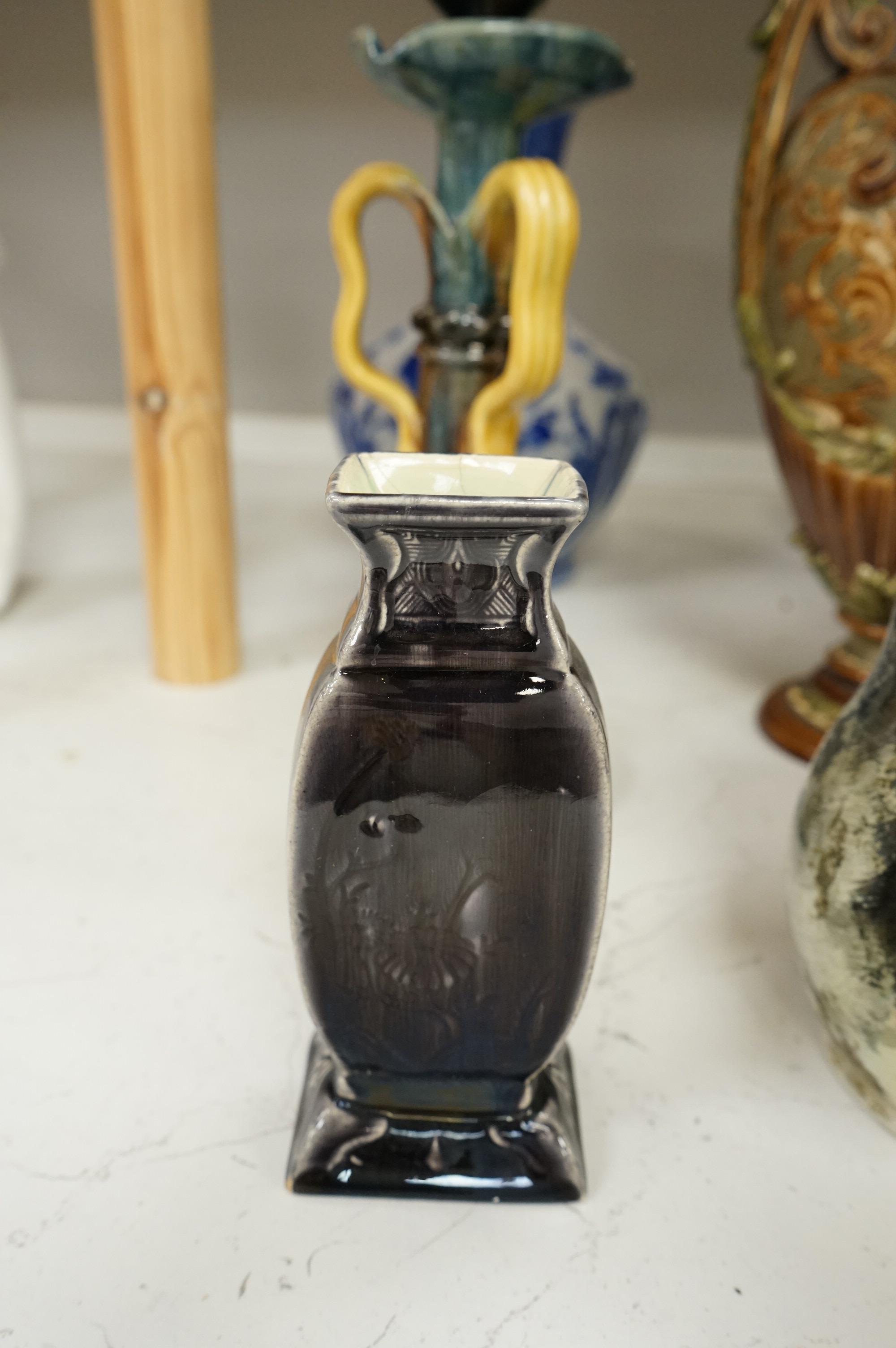 A collection of late 19th century and early 20th century European pottery and stoneware items to include a pair of glazed candlesticks stamped Belgium, largest 36cm high